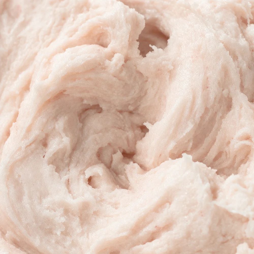 Close-up of the soft pink whipped balm texture